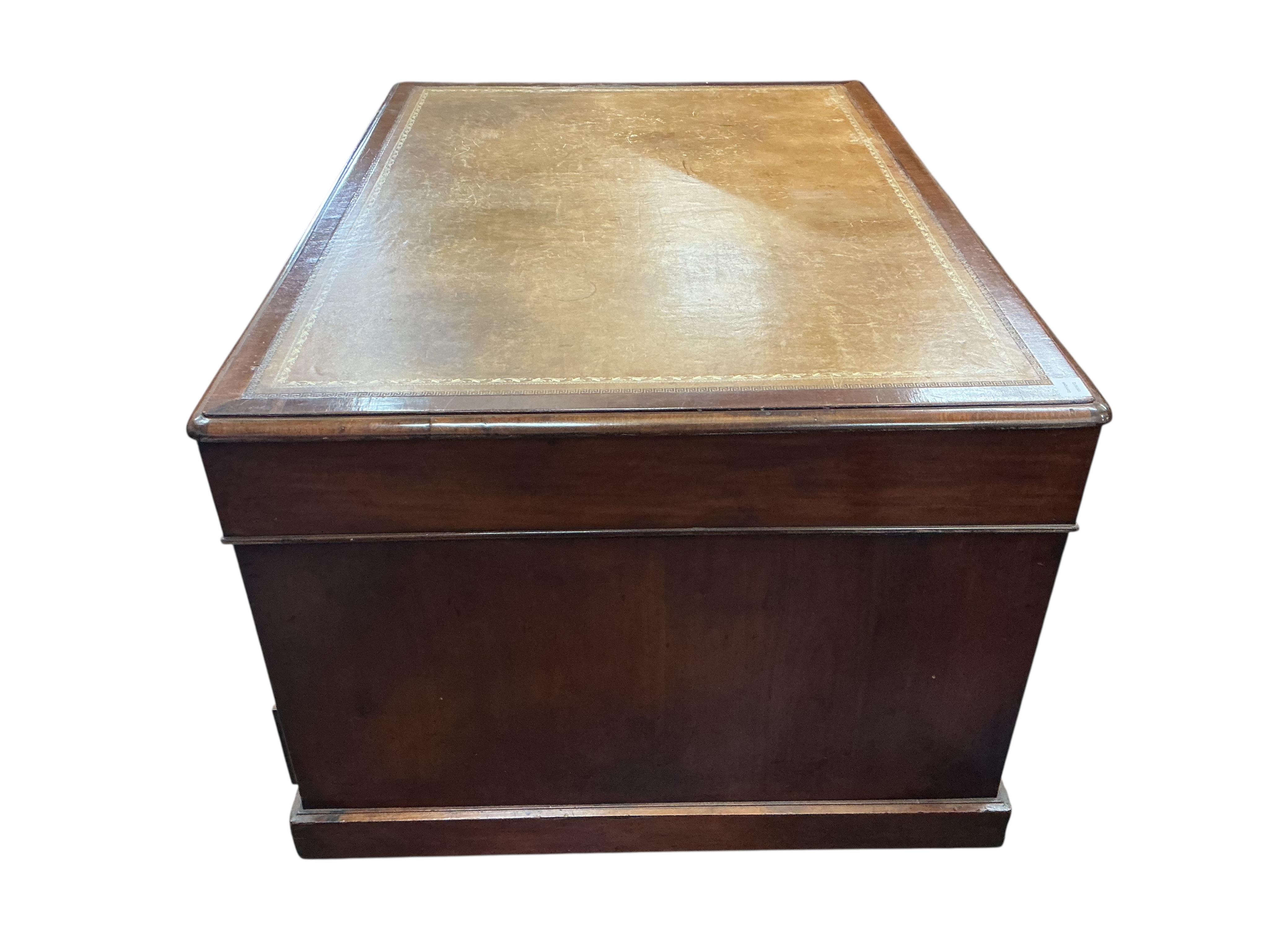 A late Victorian mahogany pedestal partner's desk, width 136cm, depth 99cm, height 78cm